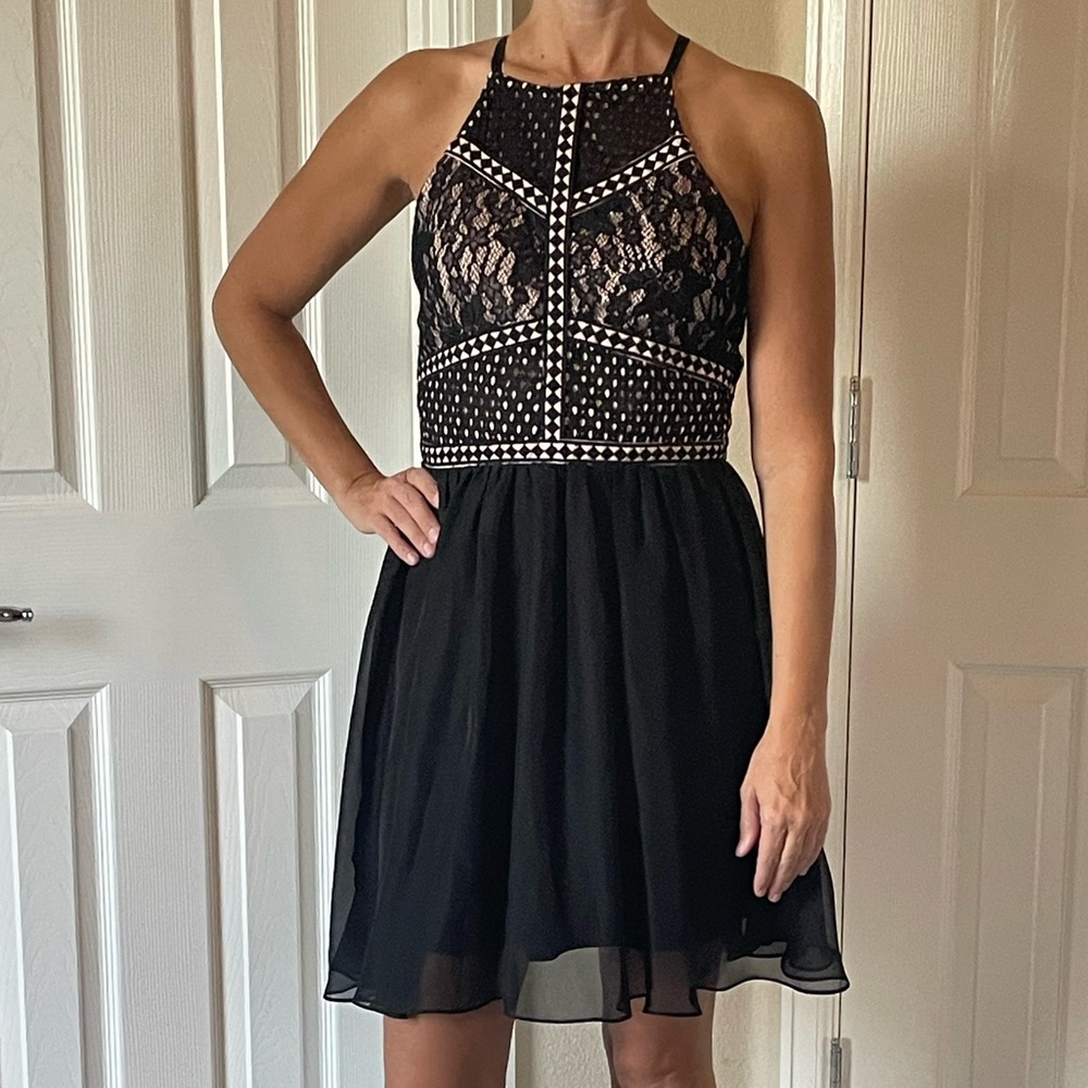 Francesca‘s size medium black and tan dress. Super cute for homecoming.